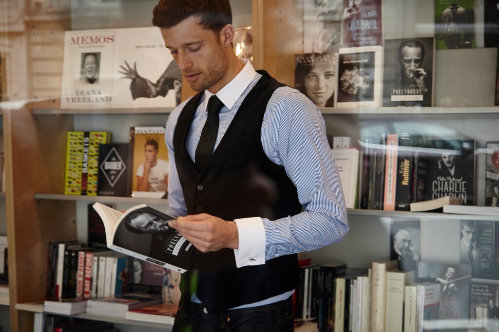 Man wearing an Amedeo French cuff shirt with cufflinks